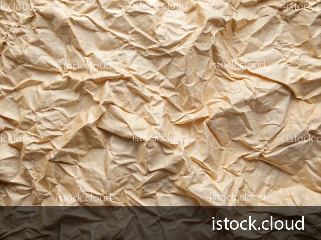 A close-up view of crumpled beige paper, showcasing its wrinkled surface and natural texture.