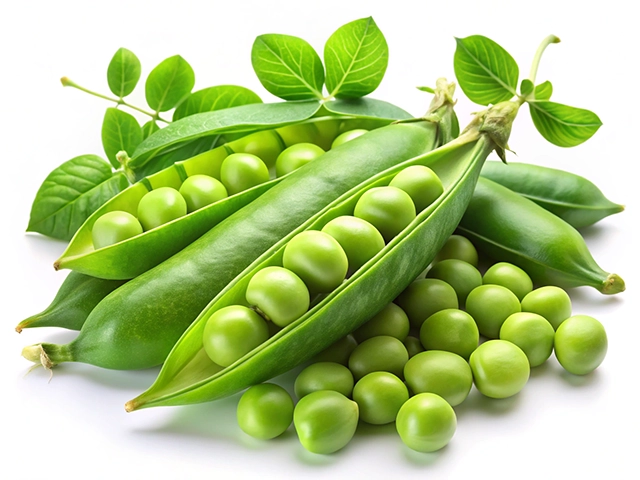 A cluster of fresh green peas in open pods and loose peas on a white background, surrounded by green leaves.