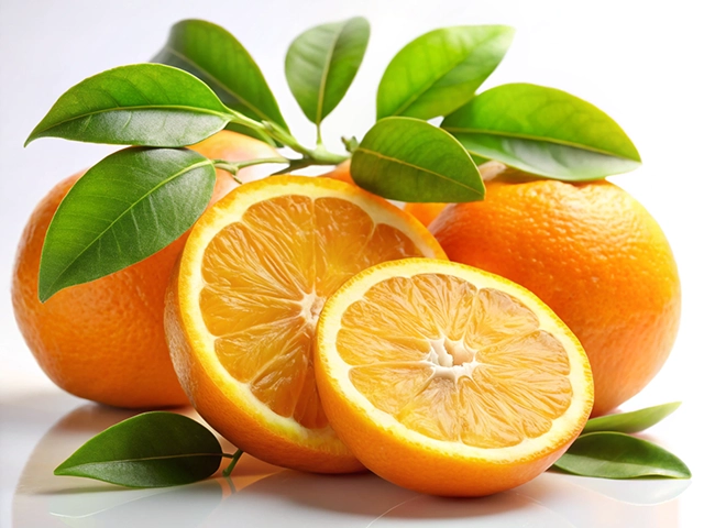 A cluster of fresh oranges with vibrant green leaves, featuring one orange sliced in half to reveal its juicy interior.
